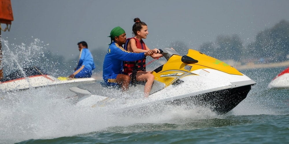 How are water-sports activities groups helping cleaner oceans?